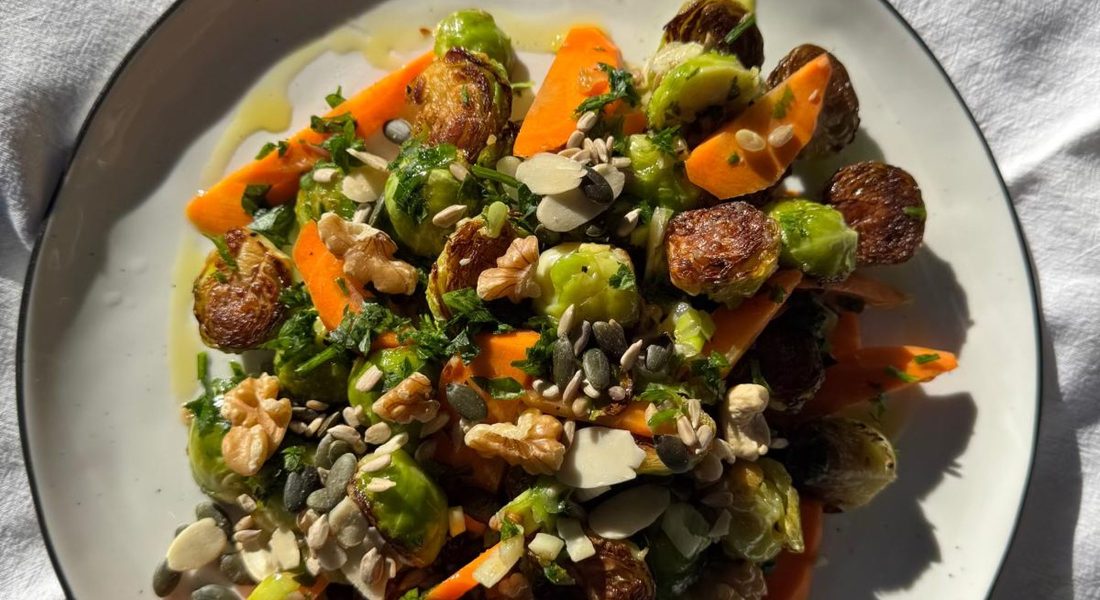 Roasted Brussels sprouts and pickled carrot salad with walnuts, pumpkin seeds, flaked almonds and extra virgin olive oil